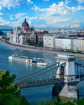 Cruise ship on the Danube River with a view of the Hungarian Parliament Building